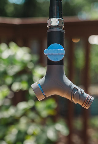 Aquor comfort grip vb hose connector hanging over a fence. 